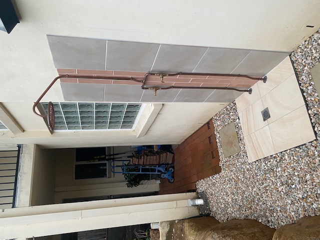 Outdoor shower plumbing installation by Ace Martin
